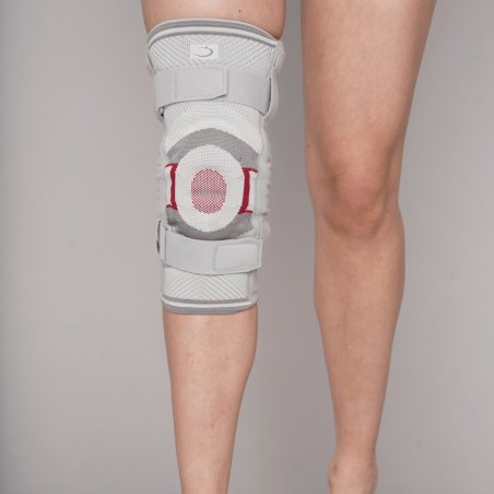 Elastic knee brace DINAMIC with lateral metal supports